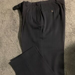 Tommy Hilfiger Men's Black Dress Pants. Pleated front.
32 x 32. Pure Wool.